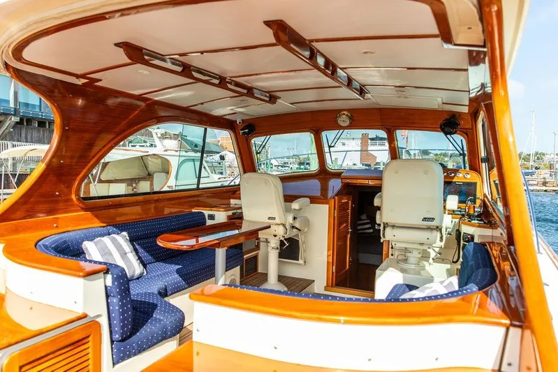 Swift Yacht Photos Pics Interior of a 2005 Hinckley Talaria 40 yacht with elegant wood finish and seating.
