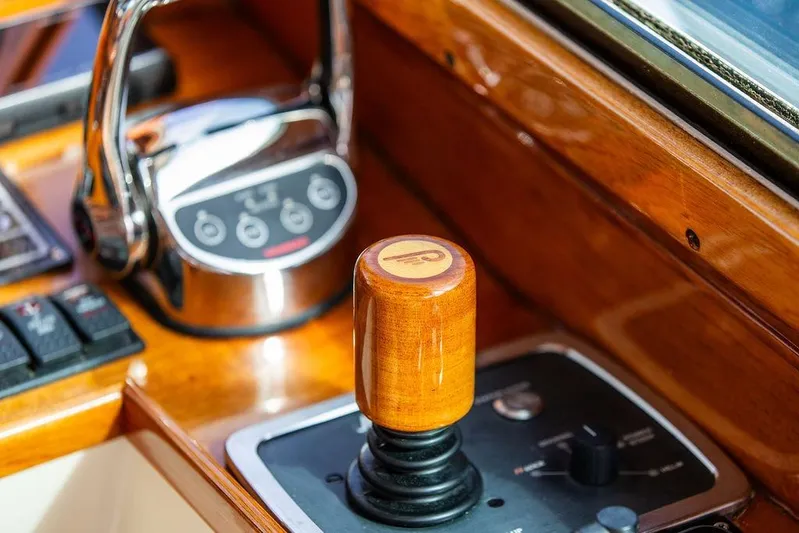 Swift Yacht Photos Pics Hinckley Talaria 40 yacht controls, featuring a wooden throttle and modern dashboard, 2005 model.