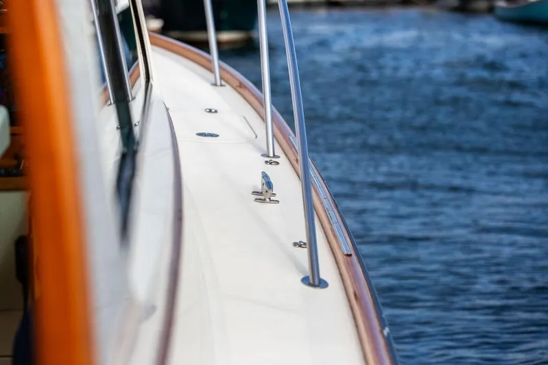 Swift Yacht Photos Pics 2005 Hinckley Talaria 40 yacht deck with polished railings by the water.