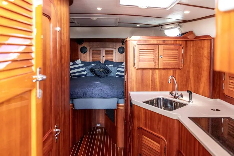 Swift Yacht Photos Pics Luxurious 2005 Hinckley Talaria 40 yacht interior with wood finish and cozy cabin.