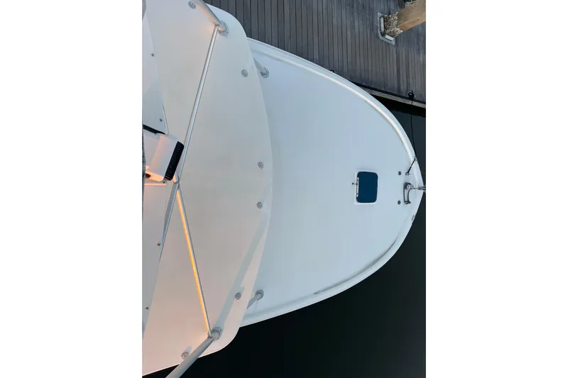 Reel Carolina II Yacht Photos Pics Top view of 2002 Out Island 38 Express Fisherman boat docked at a pier.