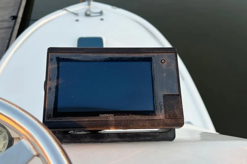 Reel Carolina II Yacht Photos Pics Garmin GPS device on 2002 Out Island 38 Express Fisherman boat dashboard.