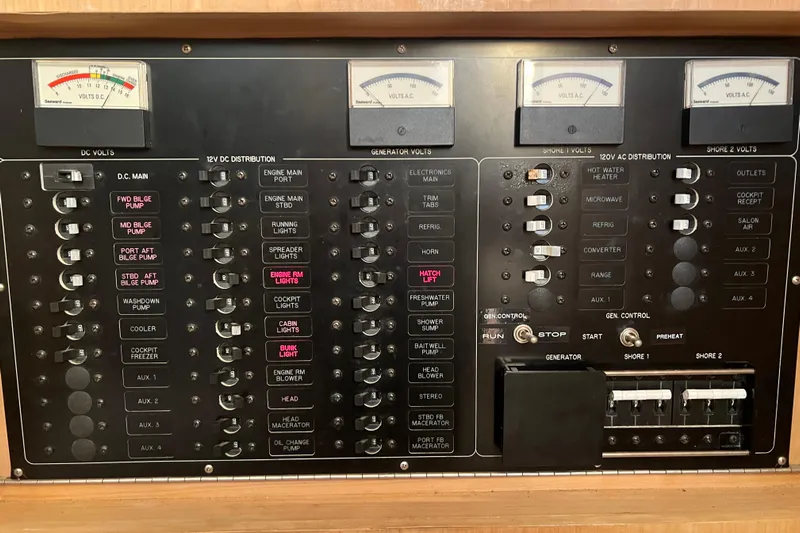 Reel Carolina II Yacht Photos Pics Electrical control panel of a 2002 Out Island 38 Express Fisherman boat.