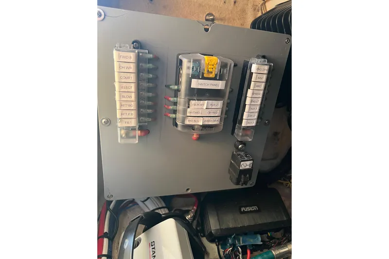 Reel Carolina II Yacht Photos Pics Electrical panel on a 2002 Out Island 38 Express Fisherman boat.