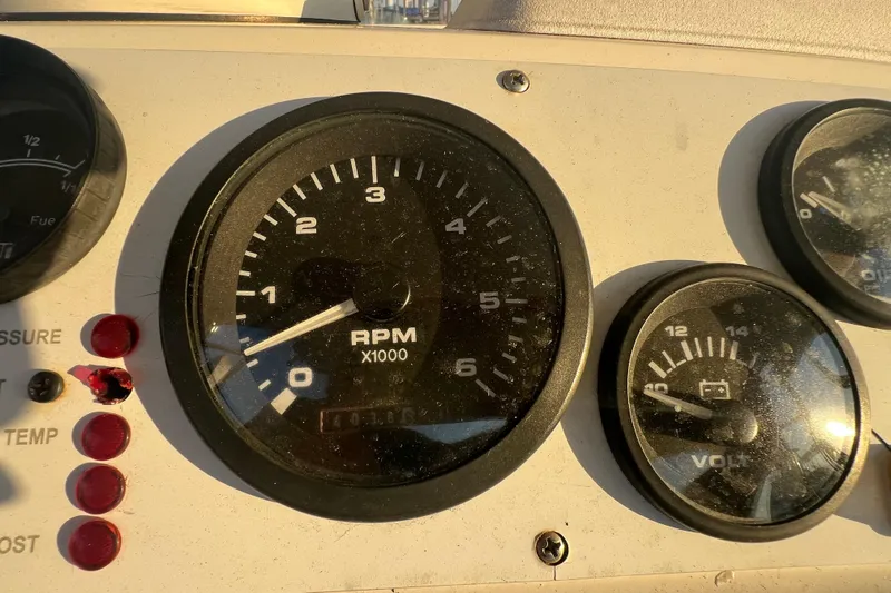 Reel Carolina II Yacht Photos Pics Close-up of 2002 Out Island 38 Express Fisherman dashboard gauges, showing RPM and voltage.