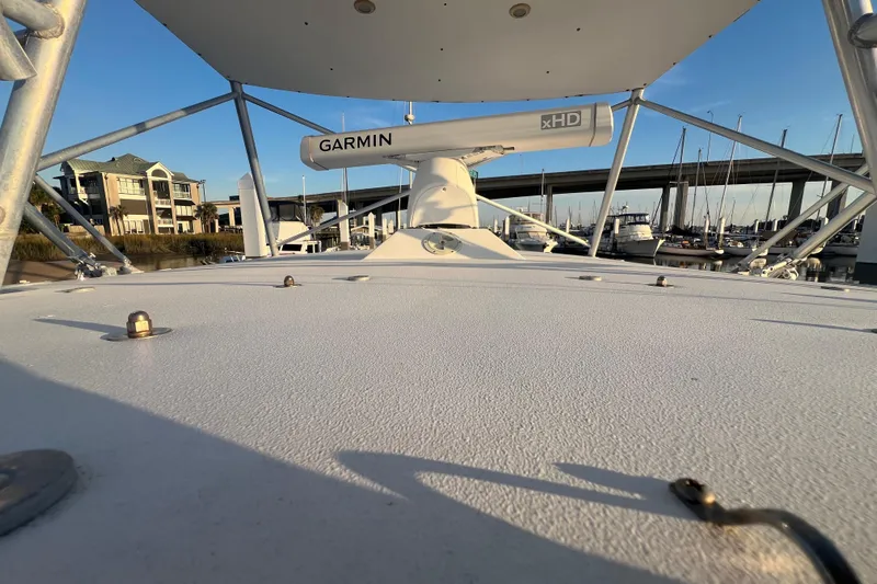 Reel Carolina II Yacht Photos Pics 2002 Out Island 38 Express Fisherman boat with Garmin radar, docked near marina and bridge.