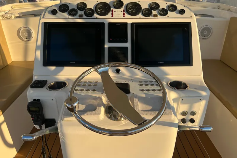 Reel Carolina II Yacht Photos Pics Helm of 2002 Out Island 38 Express Fisherman with dual screens and gauges.