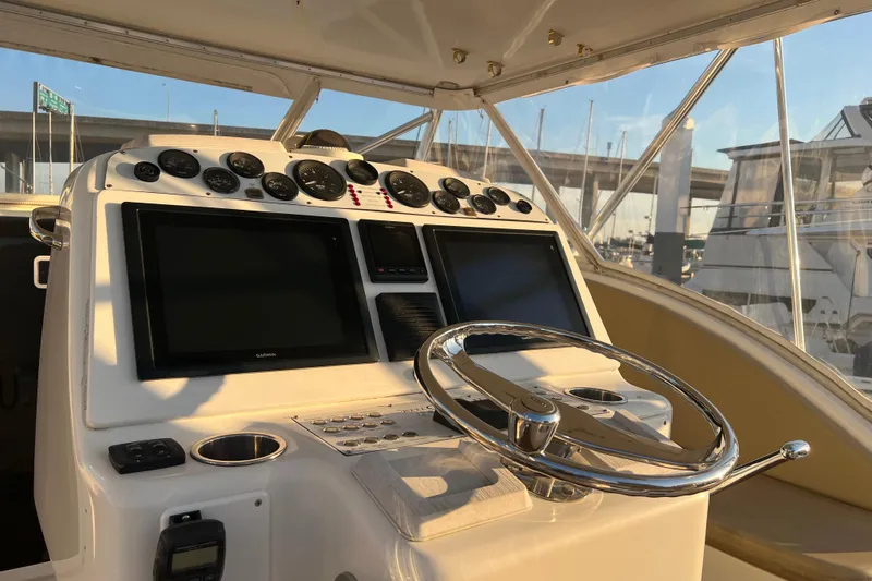 Reel Carolina II Yacht Photos Pics Helm of 2002 Out Island 38 Express Fisherman with dual screens and gauges.