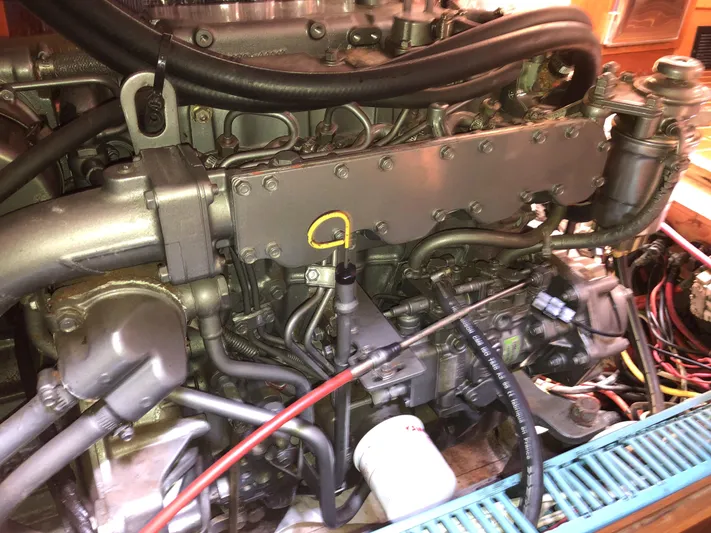 Ozymandias Yacht Photos Pics Engine of a 2001 Jeanneau 45.2 sailboat, showcasing mechanical components and wiring.