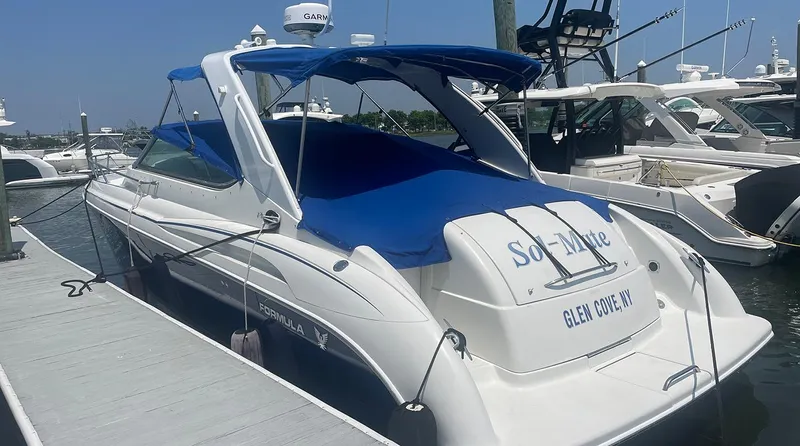 Sol Mate Yacht Photos Pics 2003 Formula 370 SS boat docked, featuring blue canopy and cover, Glen Cove, NY.