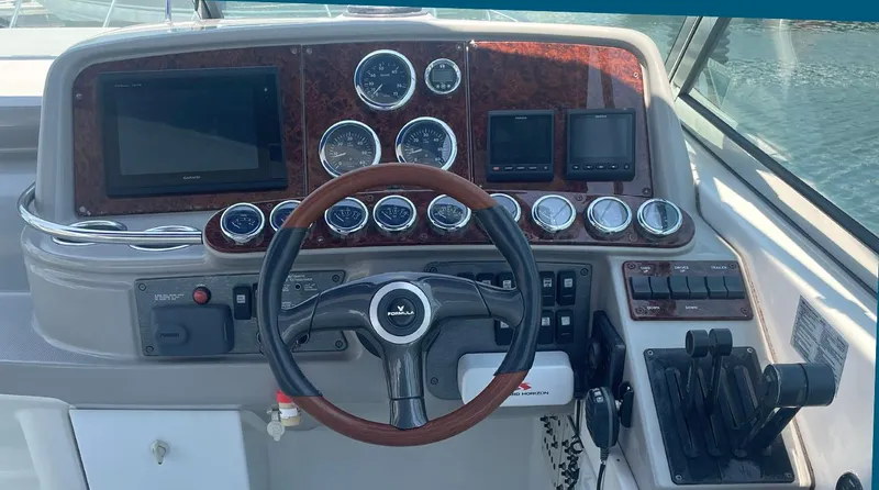 Sol Mate Yacht Photos Pics Dashboard of a 2003 Formula 370 SS boat with gauges and controls.