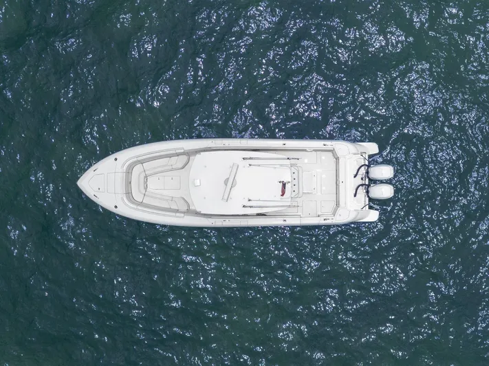  Yacht Photos Pics Aerial view of 2021 Intrepid 345 Nomad FE boat on water.