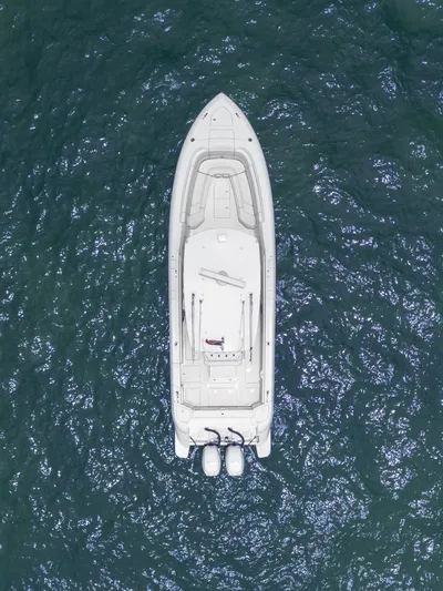  Yacht Photos Pics Aerial view of 2021 Intrepid 345 Nomad FE boat on open water.