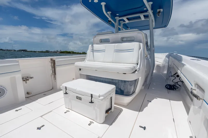 Yacht Photos Pics 2021 Intrepid 345 Nomad FE boat interior with seating and Yeti cooler.