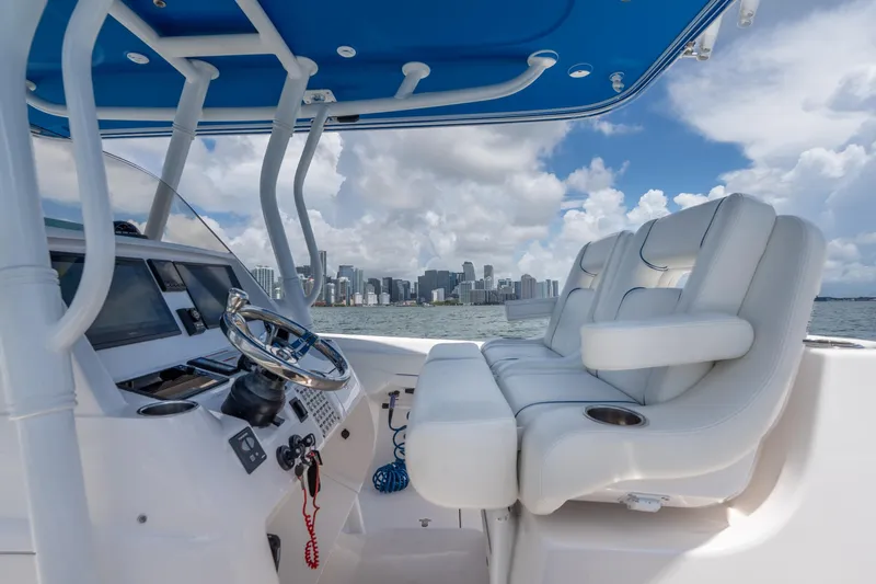  Yacht Photos Pics 2021 Intrepid 345 Nomad FE boat interior with city skyline in background.