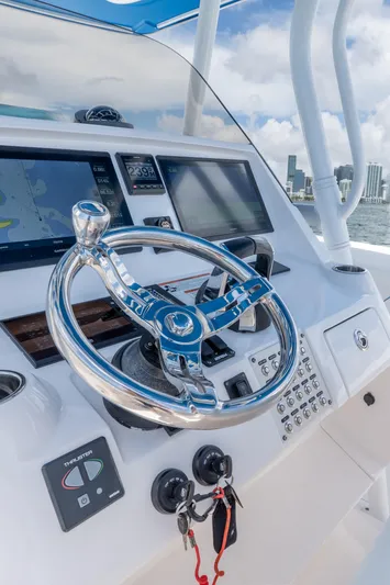  Yacht Photos Pics Steering console of 2021 Intrepid 345 Nomad FE boat with navigation screens.