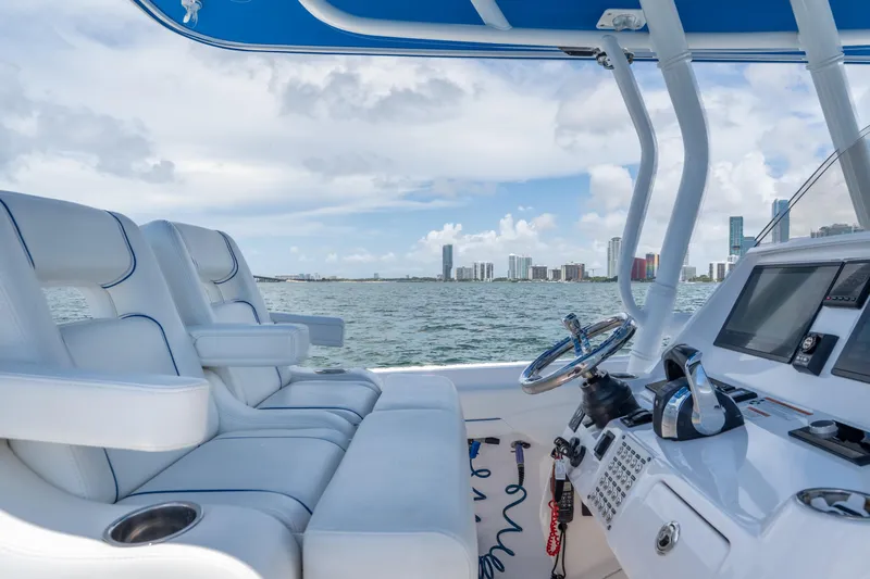  Yacht Photos Pics 2021 Intrepid 345 Nomad FE boat interior with city skyline in the background.