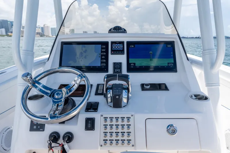 Yacht Photos Pics 2021 Intrepid 345 Nomad FE helm with advanced navigation displays and controls.