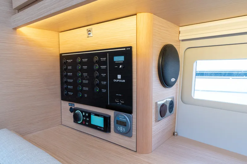 Lunar Sea Yacht Photos Pics Control panel inside 2023 Dufour 390 yacht, featuring modern navigation and audio systems.