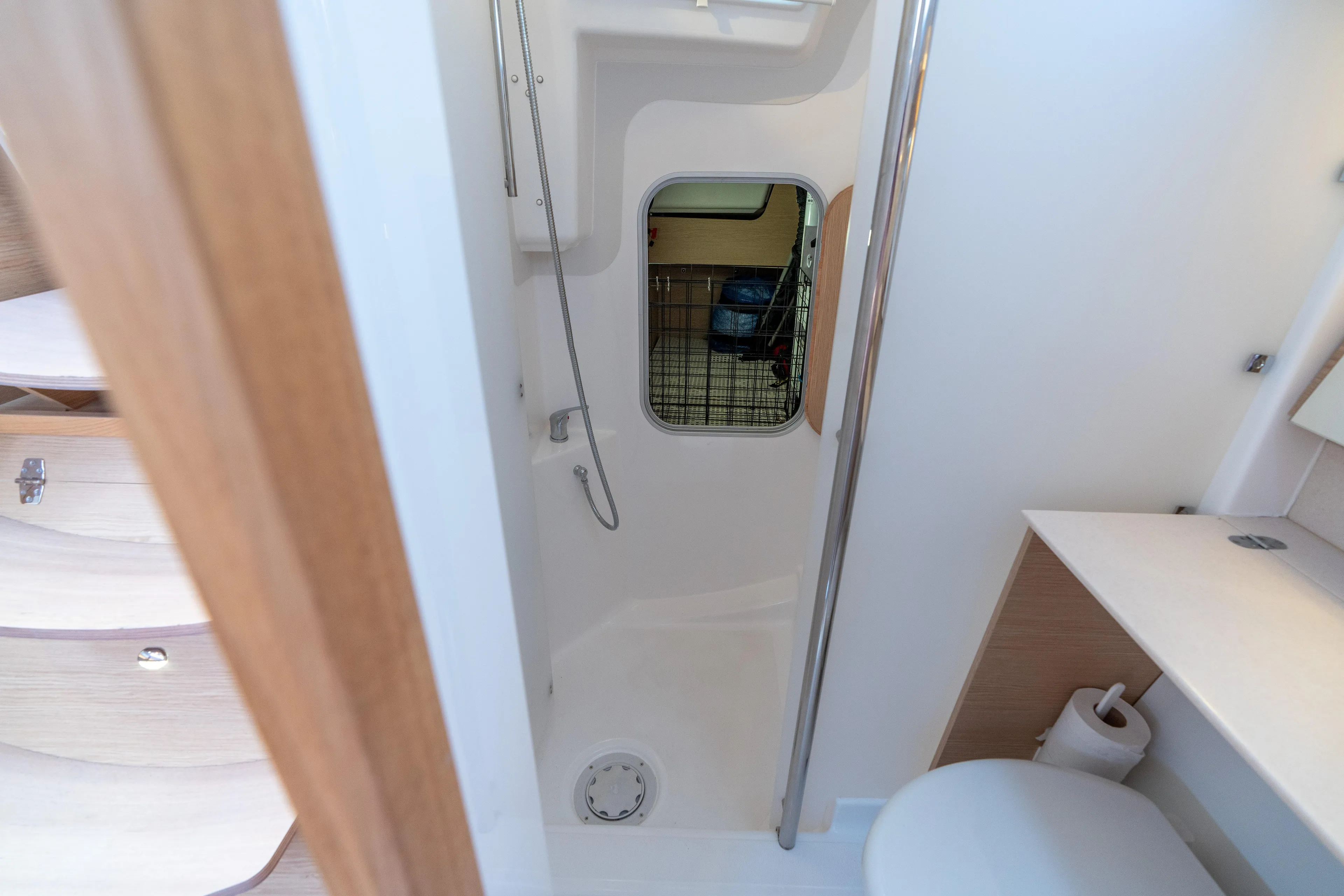 Lunar Sea Yacht Photos Pics 2023 Dufour 390 yacht bathroom with shower, toilet, and modern fixtures.