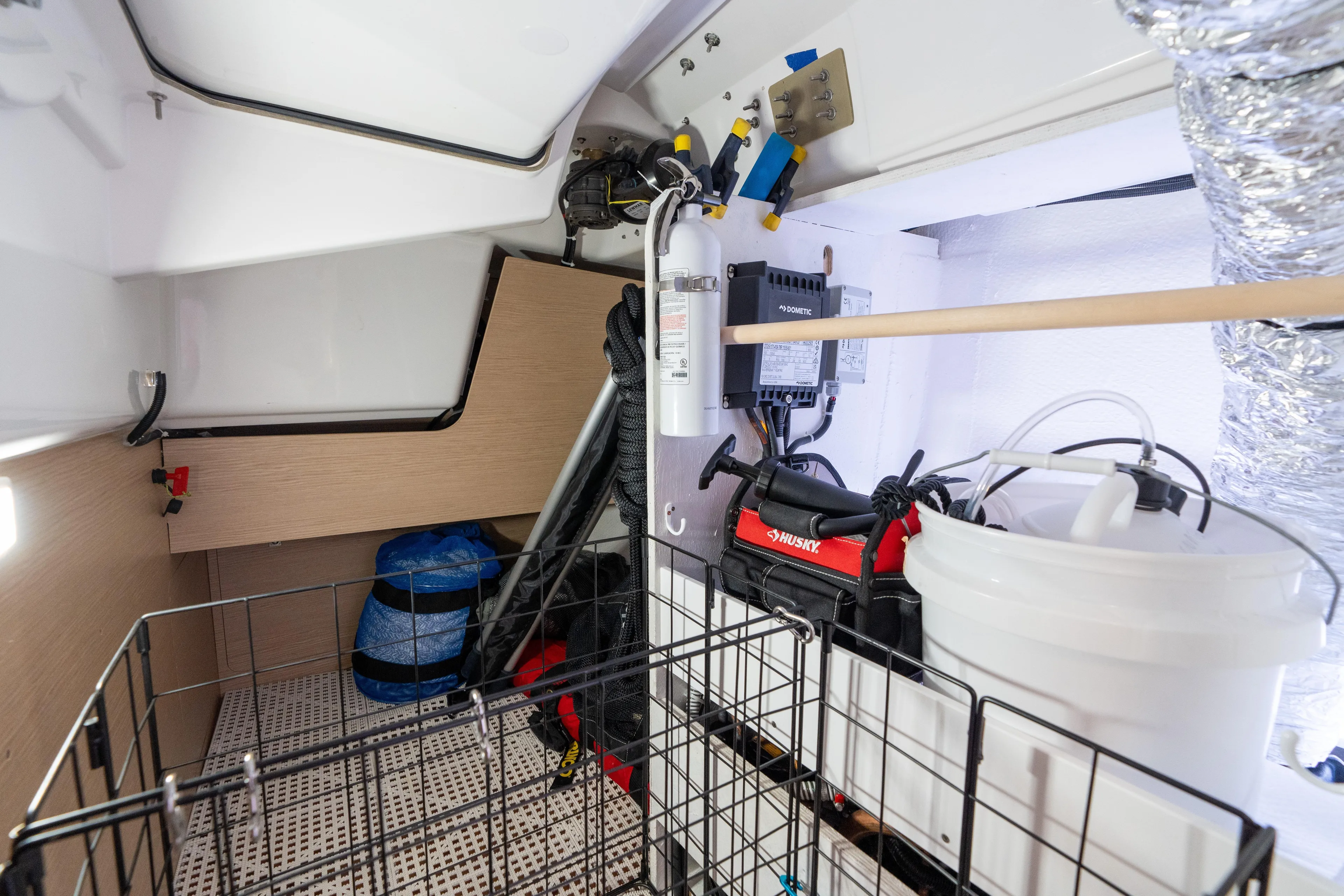 Lunar Sea Yacht Photos Pics Storage area in 2023 Dufour 390 yacht, featuring equipment and organized supplies.