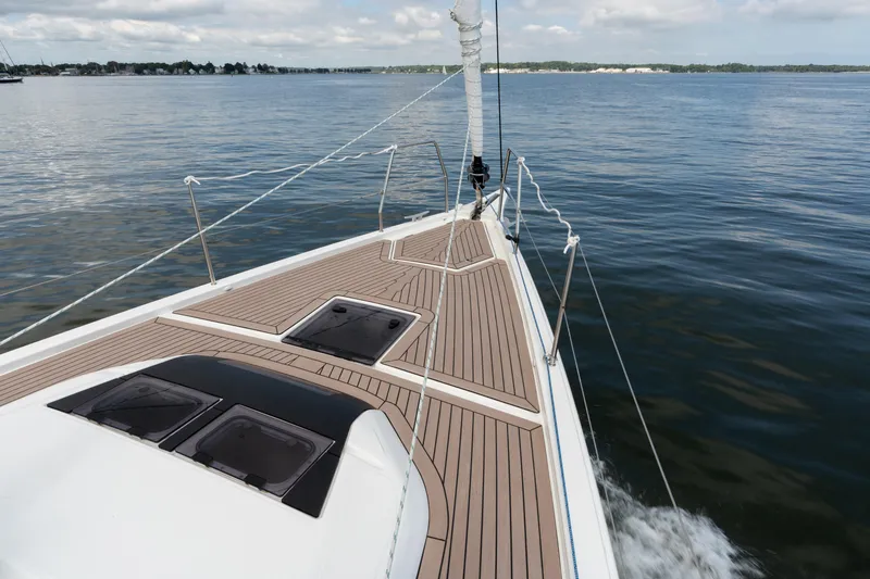 Lunar Sea Yacht Photos Pics 2023 Dufour 390 sailboat deck on calm water, showcasing sleek design and craftsmanship.