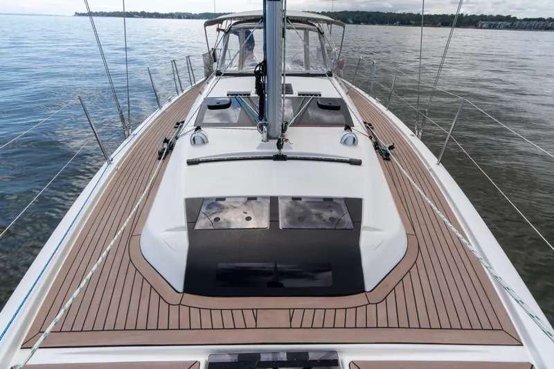 Lunar Sea Yacht Photos Pics 2023 Dufour 390 sailboat deck with sleek design on calm waters.