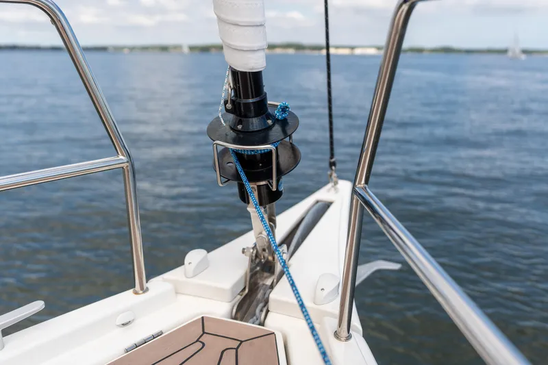 Lunar Sea Yacht Photos Pics Bow view of 2023 Dufour 390 sailboat on calm water.