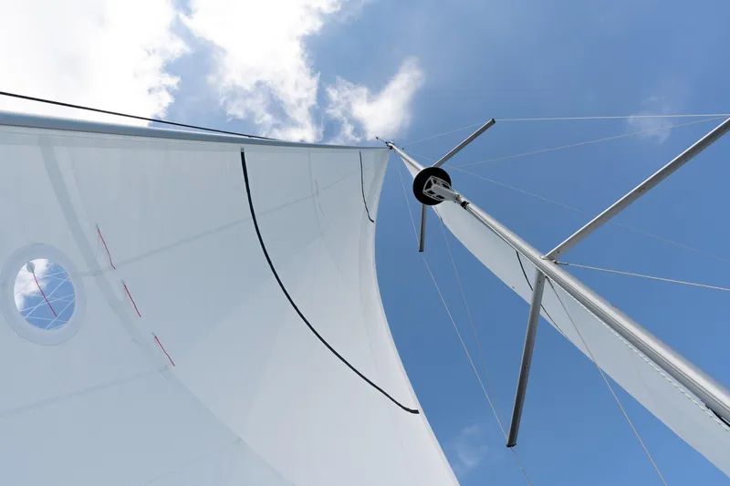 Lunar Sea Yacht Photos Pics Sail of 2023 Dufour 390 yacht against a clear blue sky.