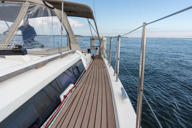 Lunar Sea Yacht Photos Pics 2023 Dufour 390 yacht deck with ocean view and clear skies.