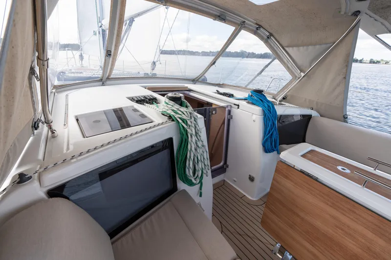 Lunar Sea Yacht Photos Pics Interior view of 2023 Dufour 390 sailboat cockpit with ropes and seating.