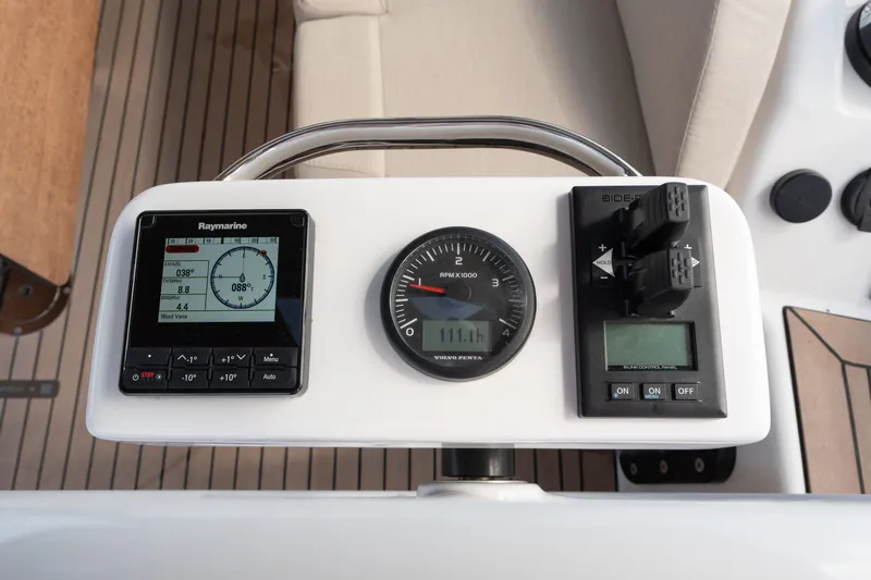 Lunar Sea Yacht Photos Pics Control panel of 2023 Dufour 390 yacht featuring Raymarine display and RPM gauge.