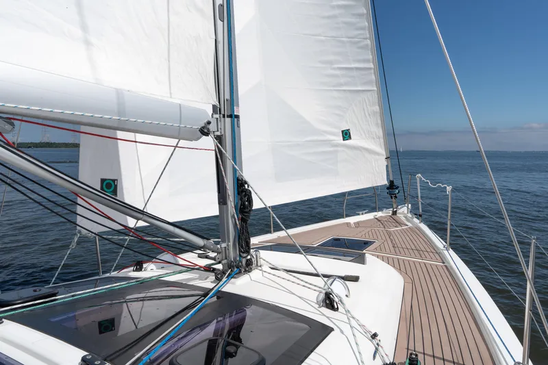 Lunar Sea Yacht Photos Pics 2023 Dufour 390 sailboat on open water, showcasing deck and sails.