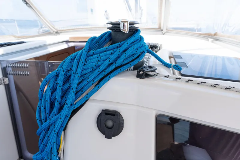 Lunar Sea Yacht Photos Pics Blue rope on a 2023 Dufour 390 sailboat deck, coiled around a winch.