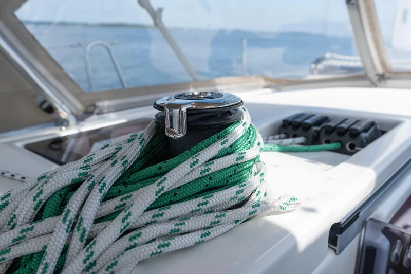 Lunar Sea Yacht Photos Pics Close-up of ropes on a 2023 Dufour 390 sailboat deck, with ocean view.