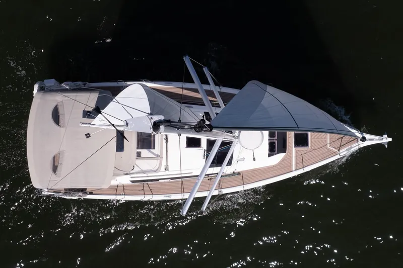 Lunar Sea Yacht Photos Pics Overhead view of 2023 Dufour 390 sailboat on water, showcasing sleek design and sails.