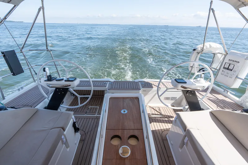 Lunar Sea Yacht Photos Pics 2023 Dufour 390 yacht cockpit with dual steering wheels on open sea.