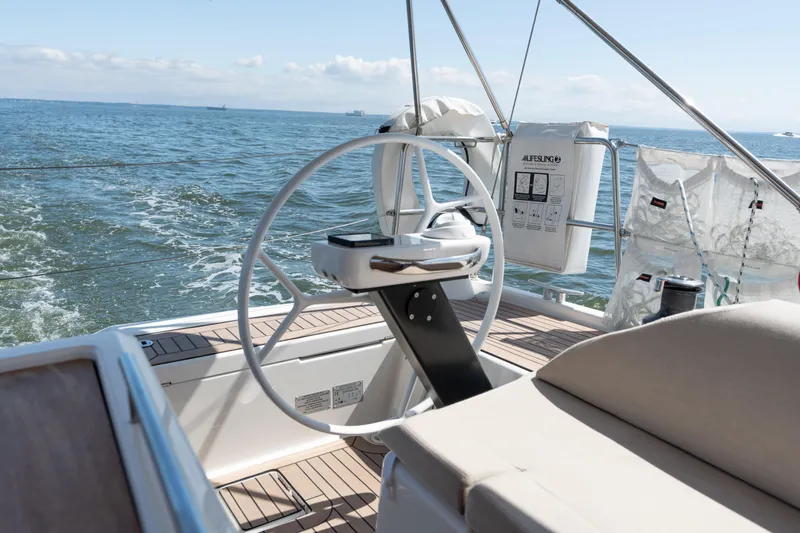 Lunar Sea Yacht Photos Pics 2023 Dufour 390 yacht helm with ocean view, showcasing elegant design and craftsmanship.