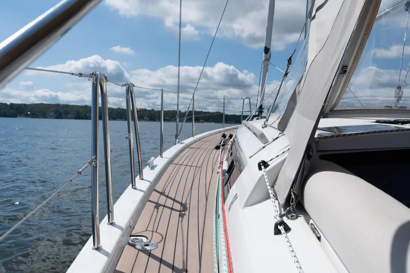 Lunar Sea Yacht Photos Pics 2023 Dufour 390 sailboat deck with clear skies and calm waters.