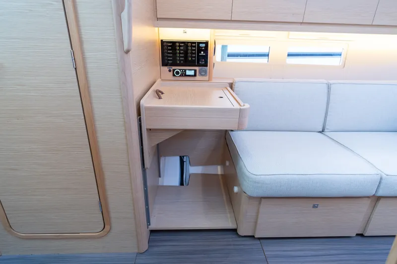 Lunar Sea Yacht Photos Pics Modern interior of 2023 Dufour 390 yacht with light wood and cozy seating.