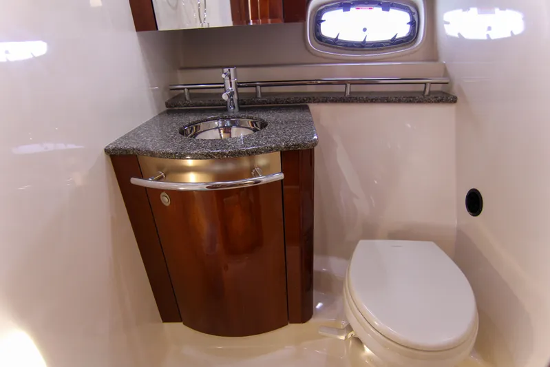 Morena Yacht Photos Pics Luxurious bathroom in 2008 Sea Ray 48 Sundancer yacht with modern fixtures and wood cabinetry.