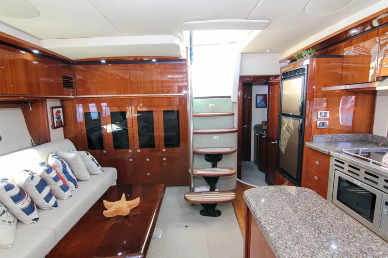 Morena Yacht Photos Pics Luxurious interior of 2008 Sea Ray 48 Sundancer yacht with modern kitchen and seating area.