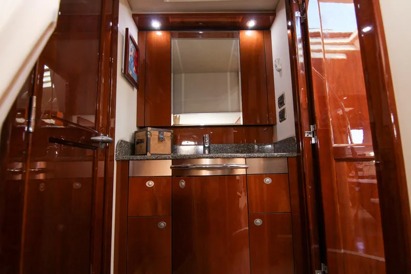 Morena Yacht Photos Pics Luxurious 2008 Sea Ray 48 Sundancer yacht interior with polished wood cabinetry and modern fixtures.