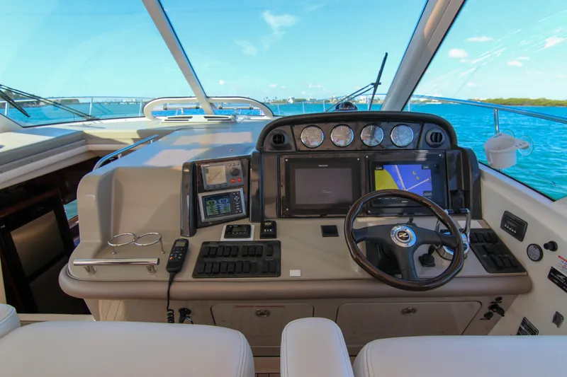Morena Yacht Photos Pics Helm of 2008 Sea Ray 48 Sundancer yacht with navigation equipment and ocean view.