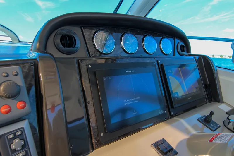 Morena Yacht Photos Pics 2008 Sea Ray 48 Sundancer helm with navigation screens and gauges.