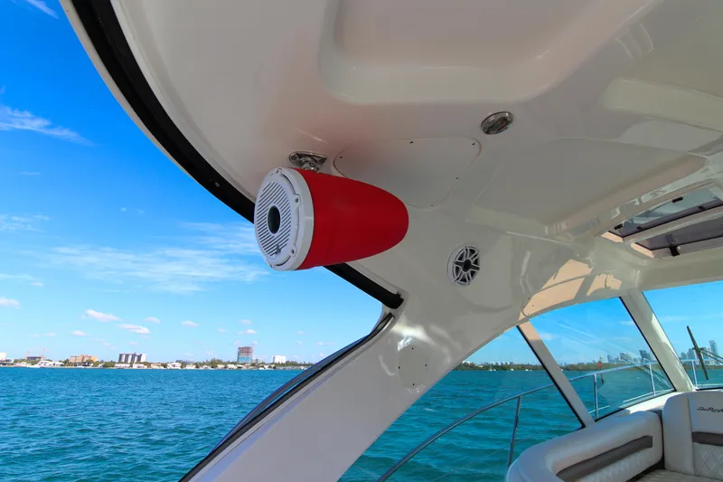 Morena Yacht Photos Pics 2008 Sea Ray 48 Sundancer yacht interior with speaker, overlooking blue ocean and city skyline.