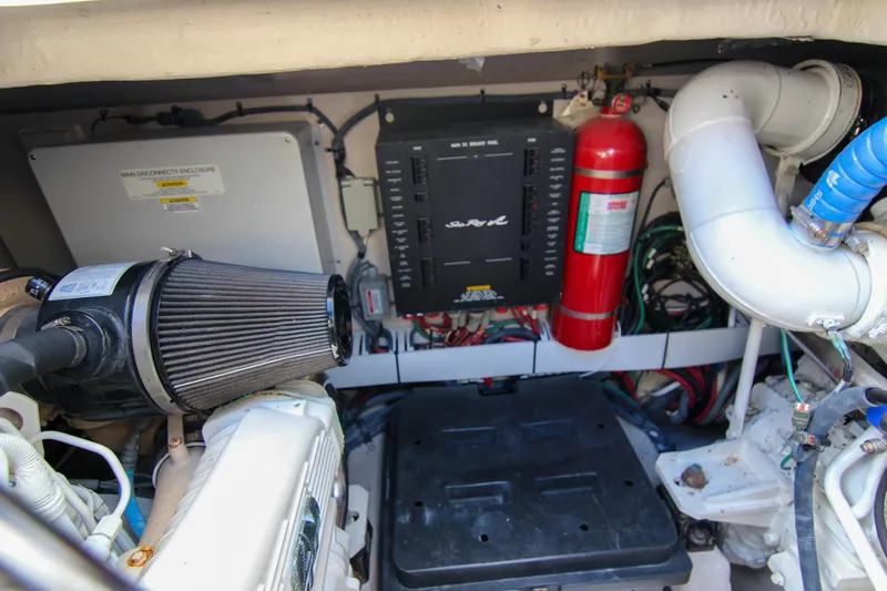 Morena Yacht Photos Pics Engine room of 2008 Sea Ray 48 Sundancer with fire extinguisher and electrical components.