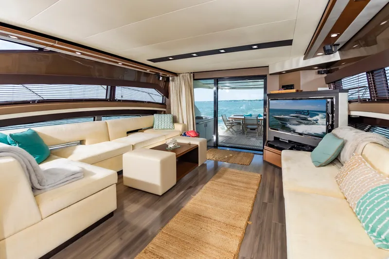 Docked Wages Yacht Photos Pics Luxurious interior of 2013 Marquis 63 Sport Yacht with elegant seating and ocean view.