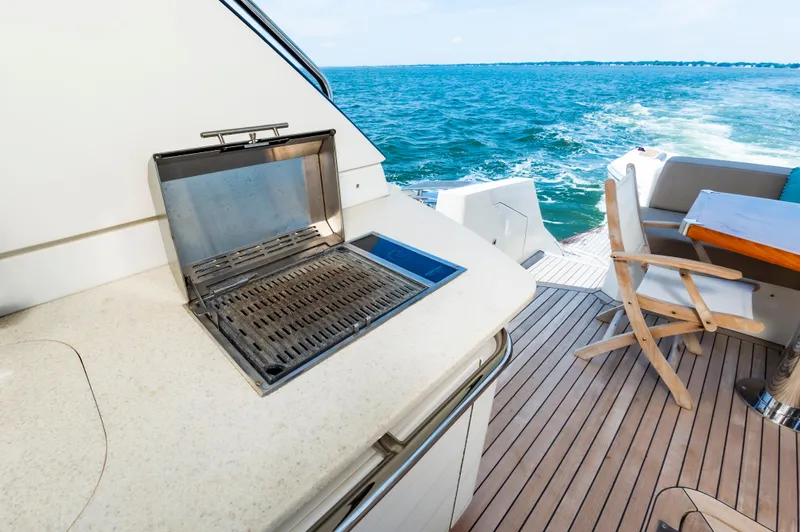 Docked Wages Yacht Photos Pics Marquis 63 Sport Yacht 2013 deck with grill and ocean view.