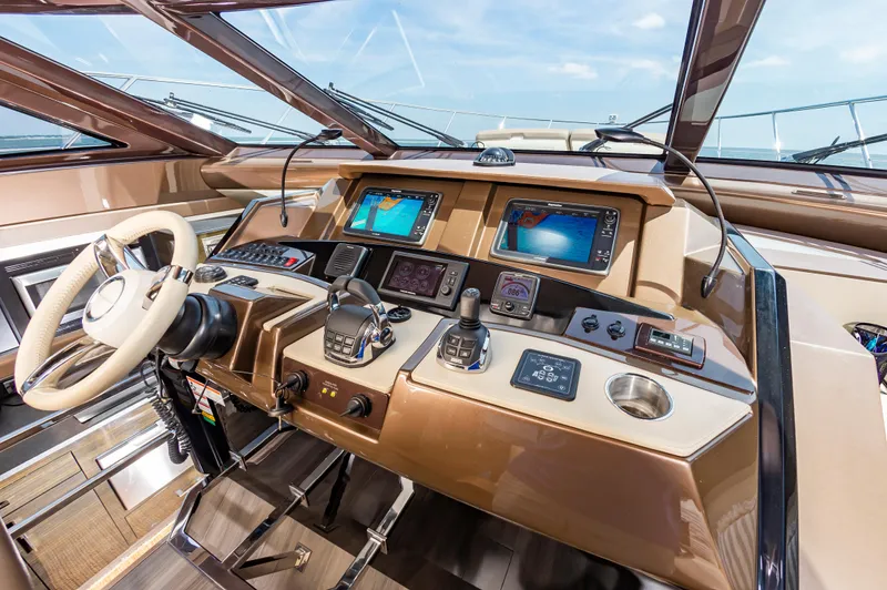 Docked Wages Yacht Photos Pics 2013 Marquis 63 Sport Yacht helm with advanced navigation controls and displays.